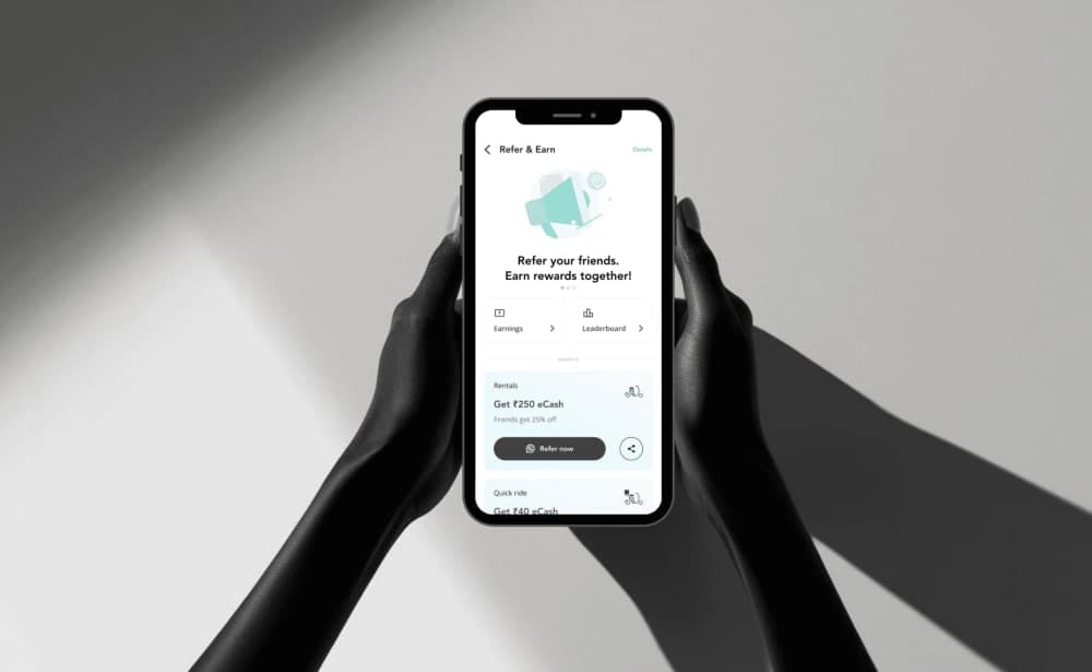 Referral app — phone in hand mockup